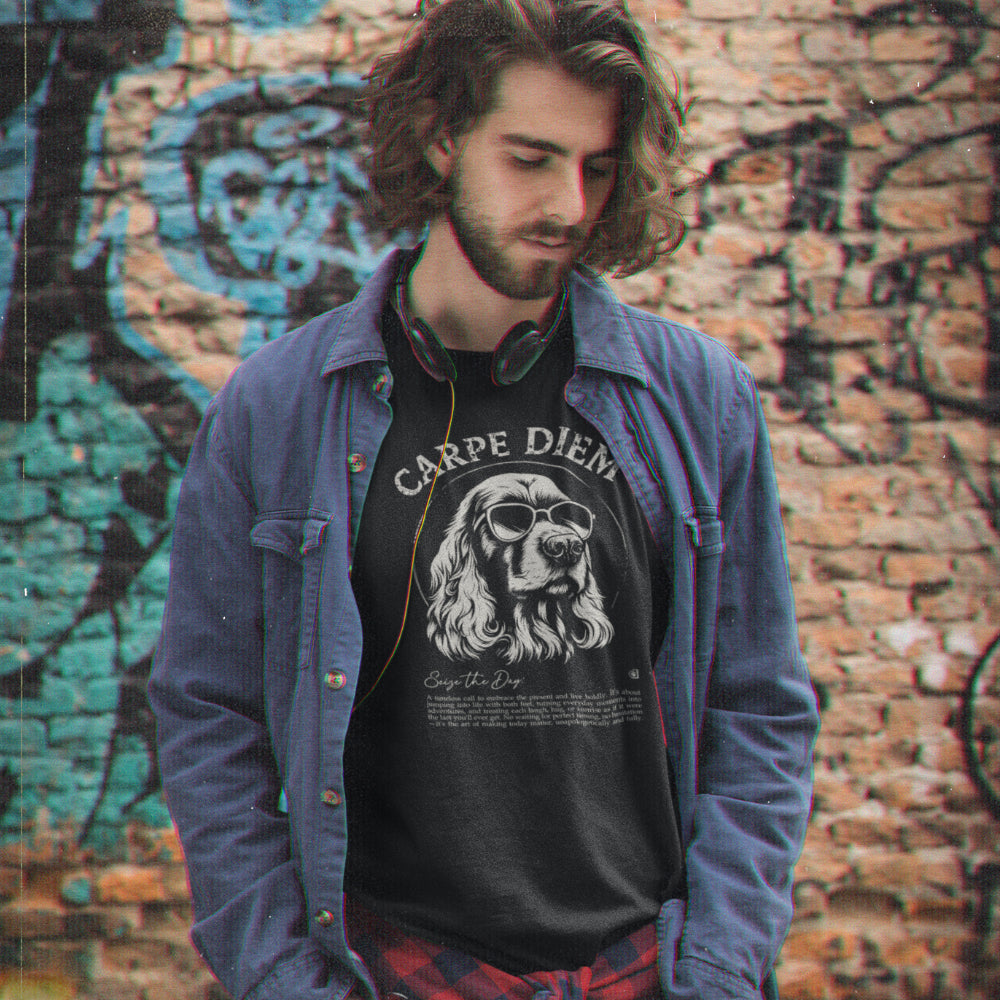 Man in a black organic cotton T-shirt featuring a cool Cocker Spaniel in sunglasses with the slogan “Carpe Diem” and a playful definition underneath.