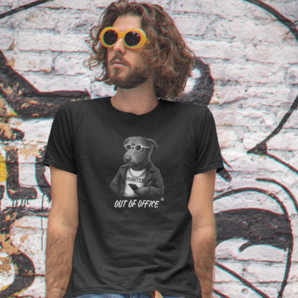 Man in a black Irish Wolfhound 'Out of Office' T-shirt with leather jacket, sunglasses, and phone on organic cotton tee.