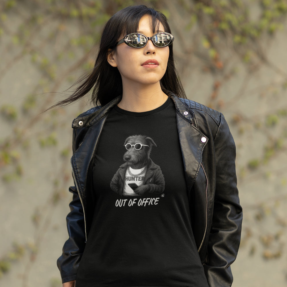 Woman in a black Irish Wolfhound 'Out of Office' T-shirt with leather jacket, sunglasses, and phone on organic cotton tee.