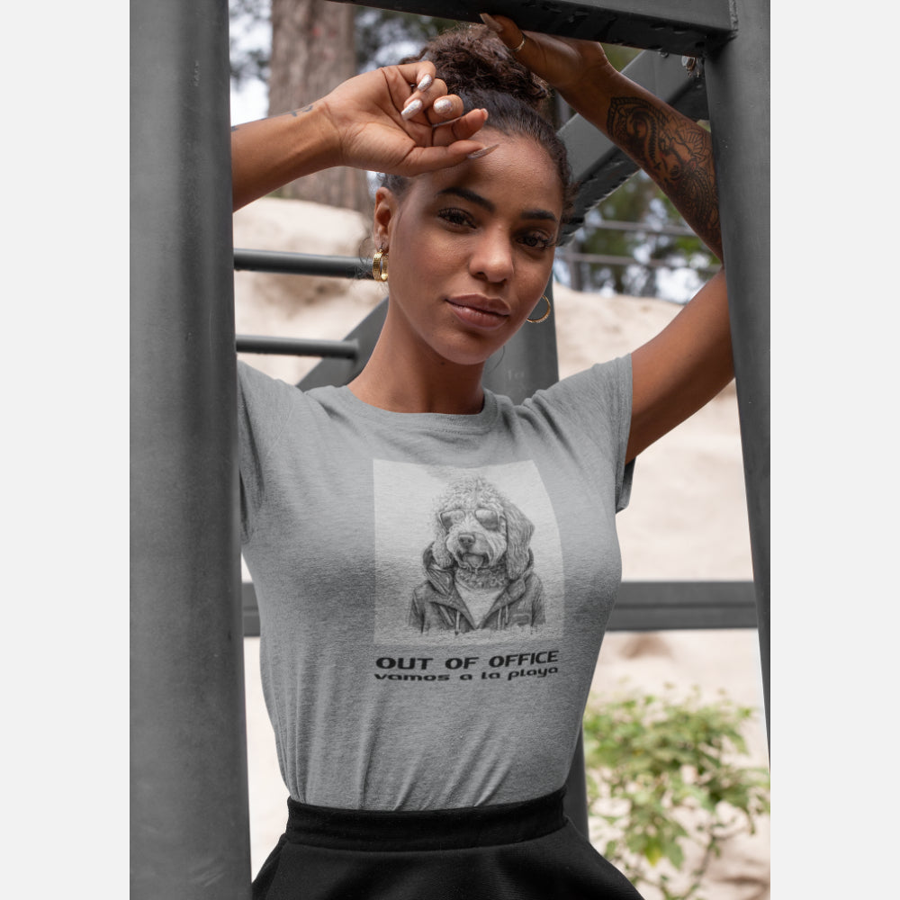 Women in a Heather Gray 'Out of Office' T-shirt featuring a cool Labradoodle illustration in sunglasses and jacket, with 'vamos a la playa' text below.