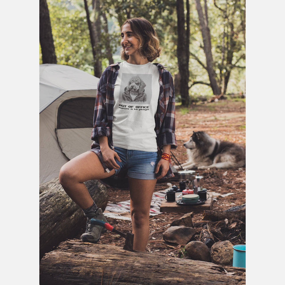 Women in an Off White 'Out of Office' T-shirt featuring a cool Labradoodle illustration in sunglasses and jacket, with 'vamos a la playa' text below.
