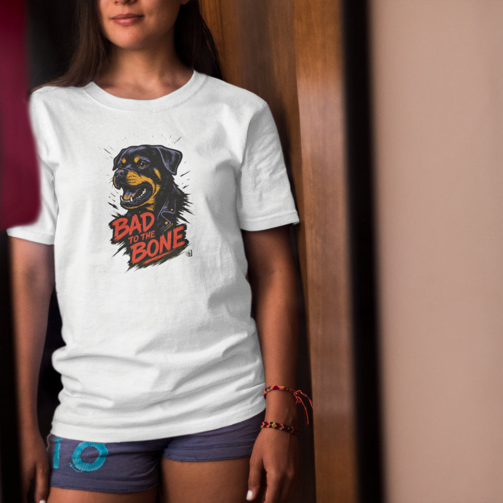 Women in a white T-shirt with street-style Rottweiler illustration and “Bad to the Bone” slogan in red. Bold gift for dog lovers with attitude.