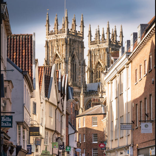 York Minster viewed along a historic street in York city centre on a sunny day