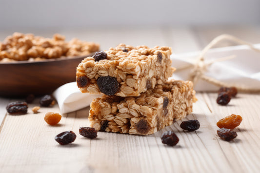 Stack of oat flapjacks with raisins on a wooden table