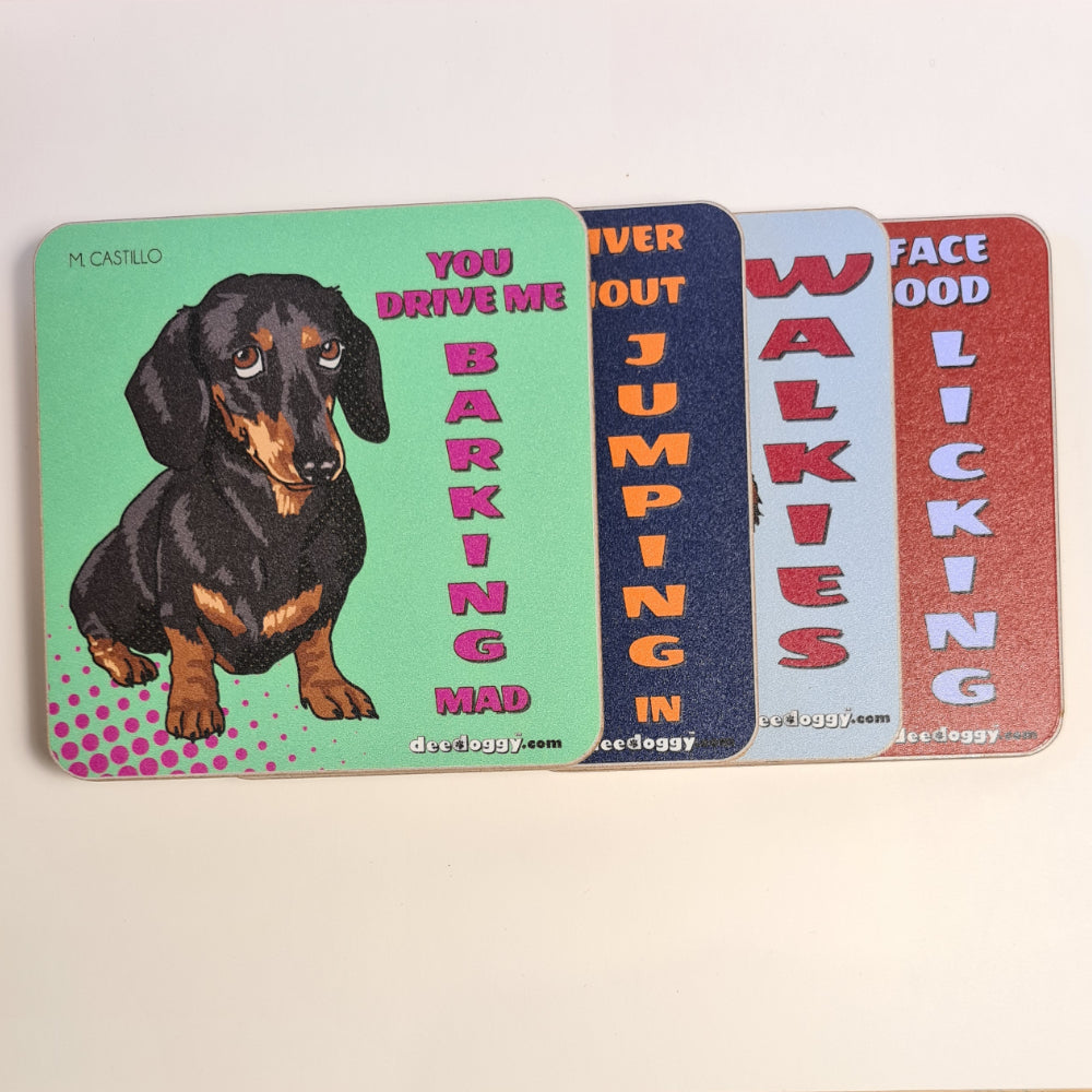 Four colorful coasters with dachshund illustrations and humorous text on a light background.