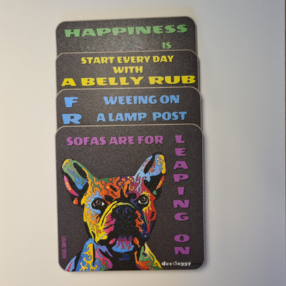 Set of four coasters with colourful dog illustration and humorous text on a black background, artist Michael Tompsett