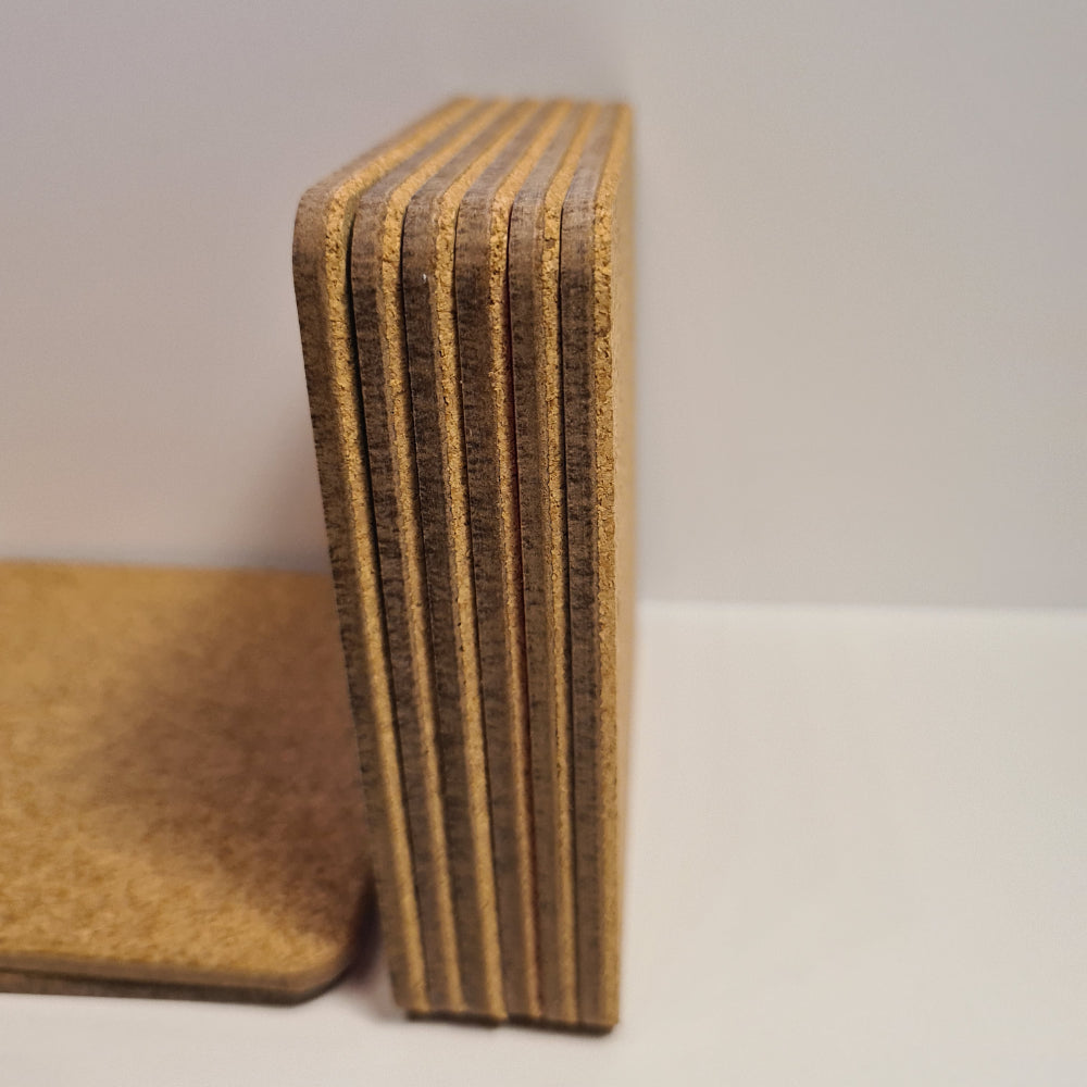 Stack of brown cardboard boxes on a white surface with a neutral background
