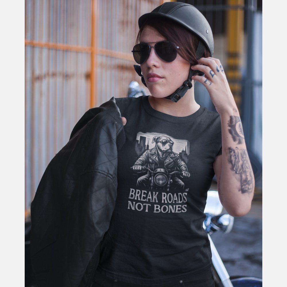 Women in a black T-shirt with American Bulldog biker design and “Break Roads Not Bones” slogan. Bold streetwear gift for edgy dog lovers.
