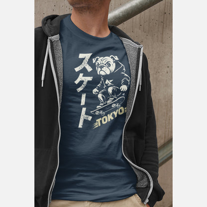 Men in an unisex navy T-shirt featuring a British Bulldog skateboarder in a streetwear illustration, with vertical Japanese “Skate” text and a muted yellow Tokyo graphic.