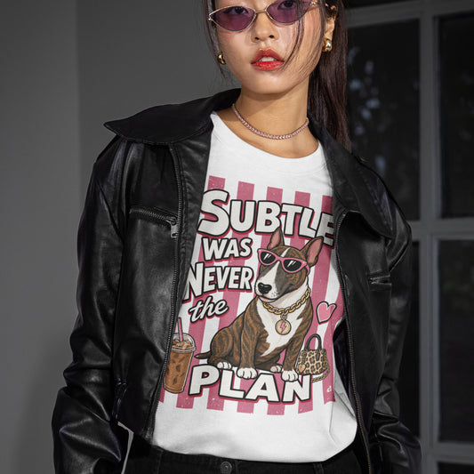 Subtle Was Never the Plan Bull Terrier T-shirt design with brindle Bull Terrier, sunglasses, gold chain, iced coffee and leopard-print bag on a white t-shirt that wearing a women