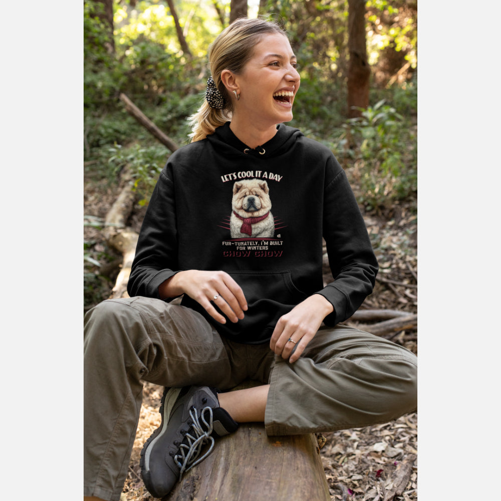 Smiling woman wearing a black "Let's Cool It a Day" Chow Chow hoodie, featuring a Chow Chow illustration and winter-themed text.