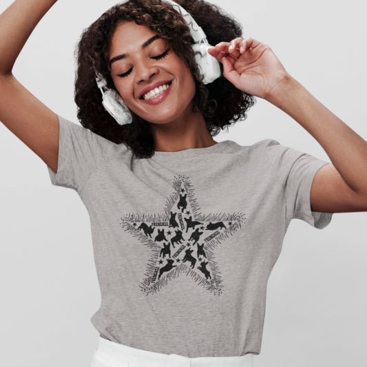 Women in a heather grey organic cotton T-shirt featuring a large black star graphic filled with dog silhouettes and surrounded by sketchy fur-like edges