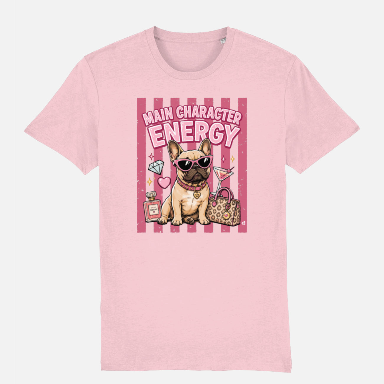 A light pink t-shirt featuring a cartoon graphic of a French Bulldog wearing sunglasses, next to a leopard print handbag and diamonds, with the text 'MAIN CHARACTER ENERGY' on a pink striped background.