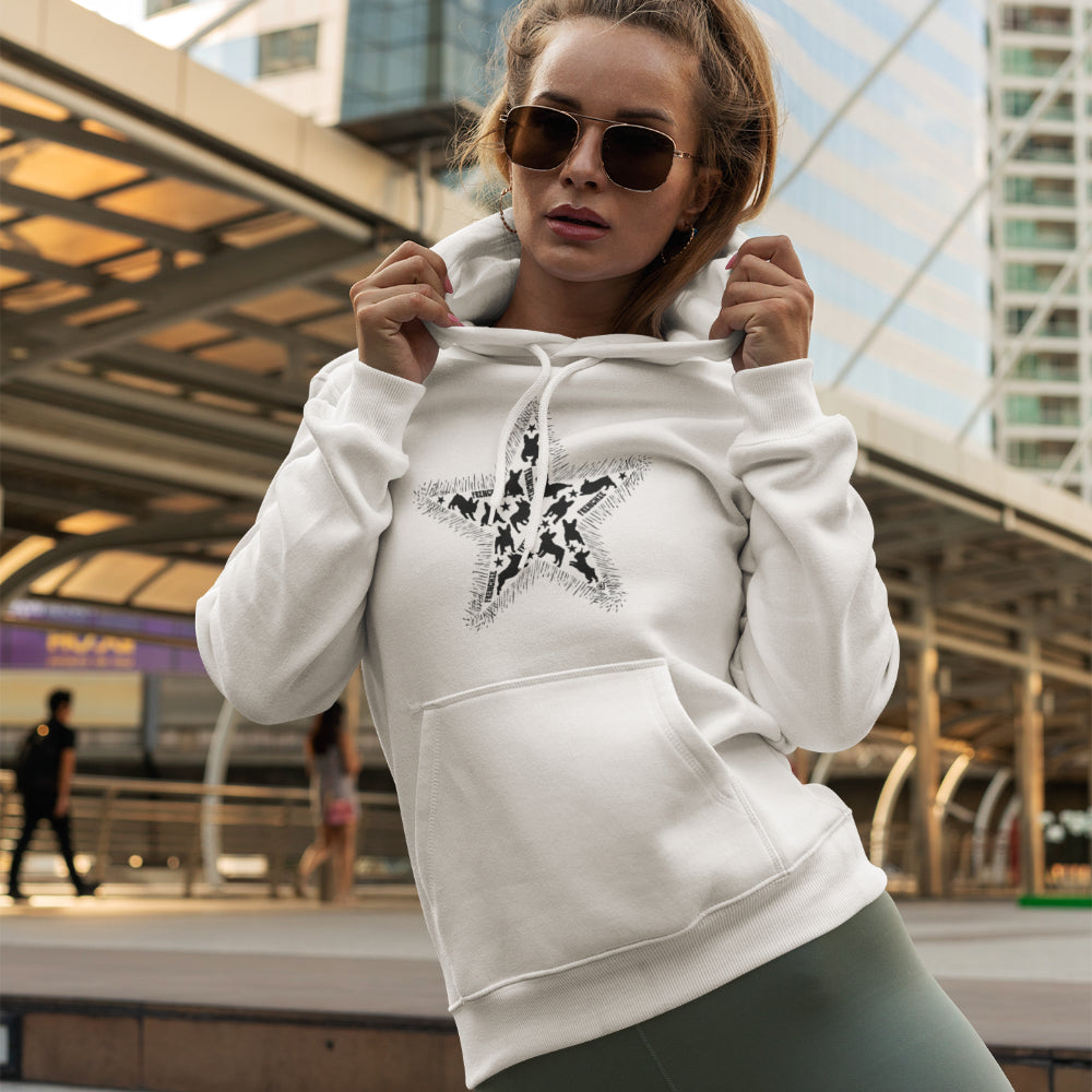 Woman in white 'Frenchie Star' hoodie featuring a bold star design filled with black French Bulldog silhouettes, perfect for Frenchie lovers.