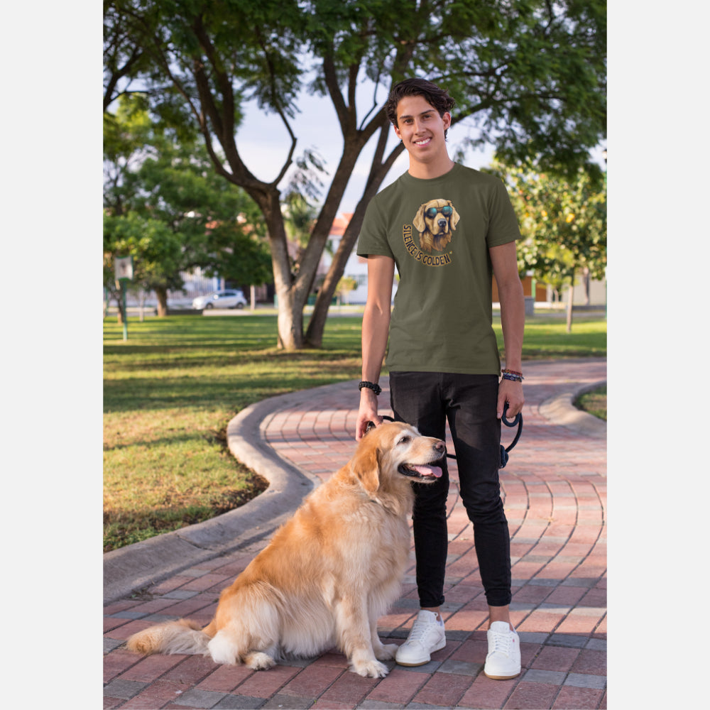 A man in a khaki T-shirt features a golden retriever with sunglasses and the text 'Silence is Golden' showcasing a cool, laid-back design for dog lovers.