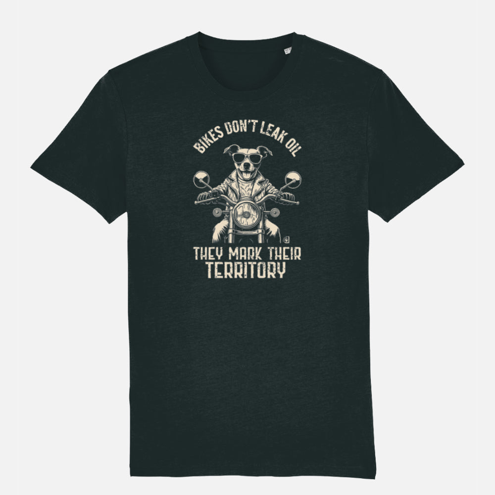 Black T-shirt featuring a biker-style Jack Russell Terrier riding a motorcycle, wearing sunglasses and a leather jacket, with the slogan “Bikes Don’t Leak Oil, They Mark Their Territory” printed above and below the illustration in a vintage font.