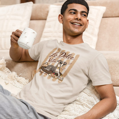 A man is wearing a Vintage White T-shirt featuring a graphic print of an Italian greyhound dog wearing sunglasses, sitting on a cushion with a cup of coffee, under the text 'La Dolce Vita'. 