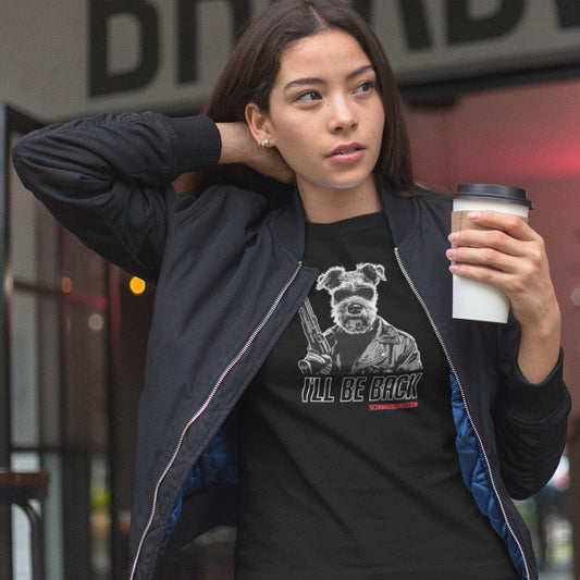 Woman wearing a black 'I’ll Be Back' Schnauzer T-shirt, featuring a Terminator-inspired Schnauzer illustration and humorous text