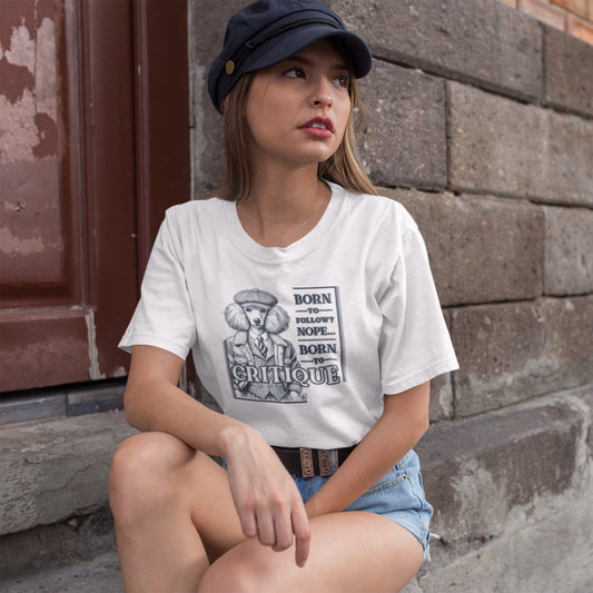 Woman in White 'Born to Critique' Poodle T-shirt featuring a stylish celestial indigo blue Poodle illustration in vintage attire with a witty slogan