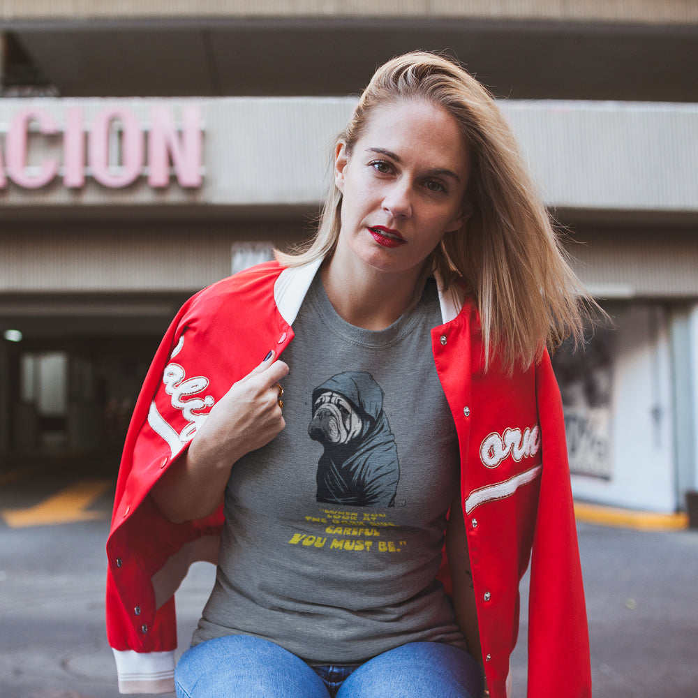 Women in Mid Heather Grey 'When you Look at the Dark Side' T-shirt featuring a stoic Shar-Pei in a hooded cloak, inspired by sci-fi, with yellow text.