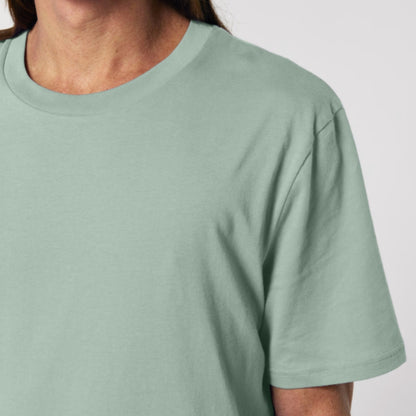 Aloe coloured t-shirt worn by a person on a white background