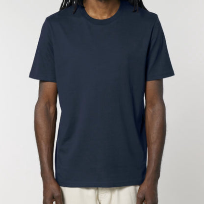 Person wearing a navy blue t-shirt against a plain background