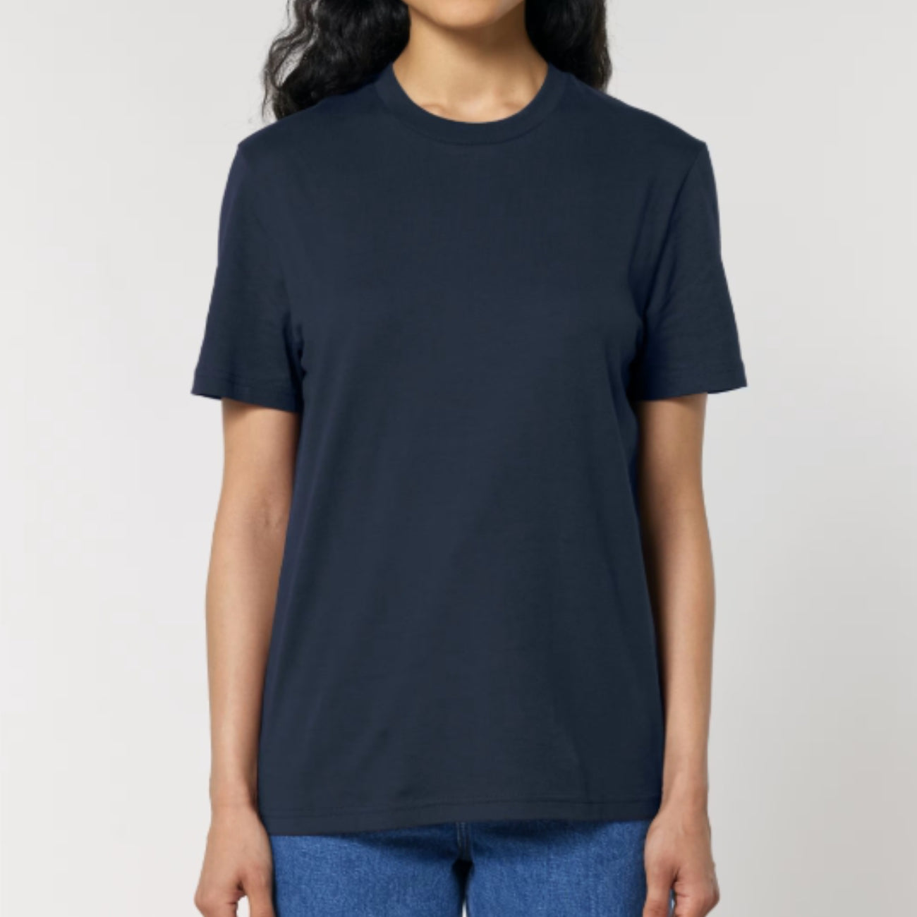 Person wearing a navy blue t-shirt against a plain background