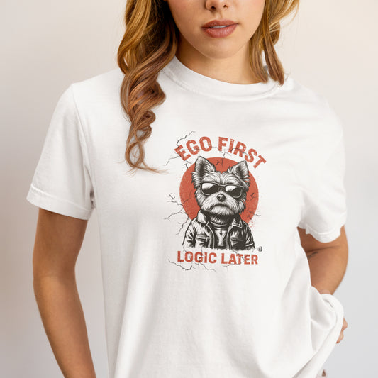 Women in a white organic cotton unisex T-shirt featuring a Yorkie in sunglasses and leather jacket with the slogan “Ego first, logic later.